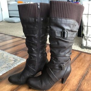 Brown zip up calf boots.